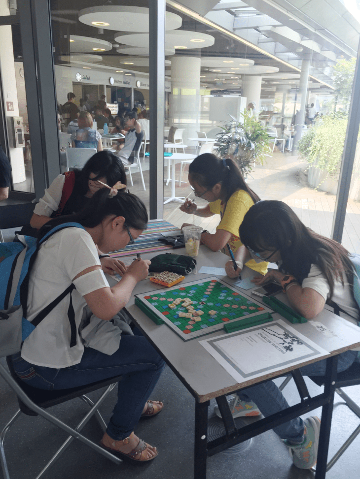 students writing on cards